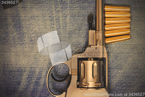 Image of Nagan revolver with cartridges