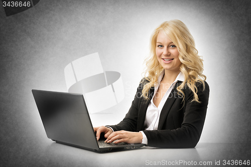 Image of woman working on laptop