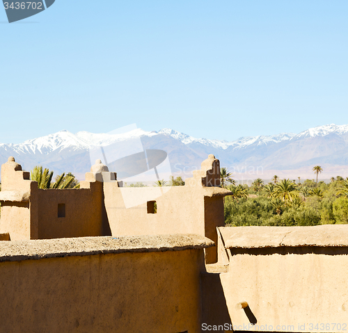 Image of brown  tower  old  construction in  africa morocco and  clouds  