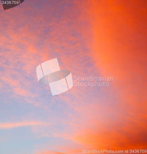 Image of sunrise in the colored sky white soft clouds and abstract backgr