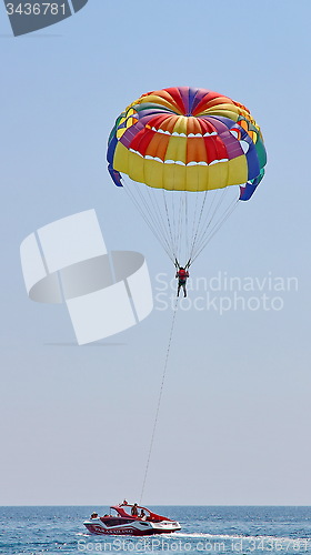 Image of Parasailing in a blue sky