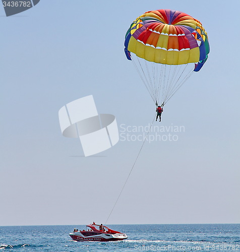 Image of Parasailing in a blue sky