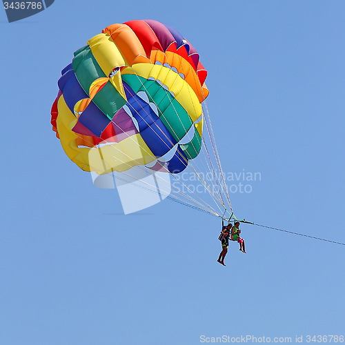 Image of Parasailing in a blue sky