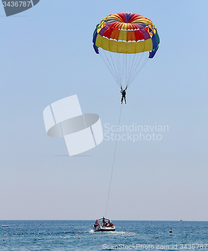 Image of Parasailing in a blue sky