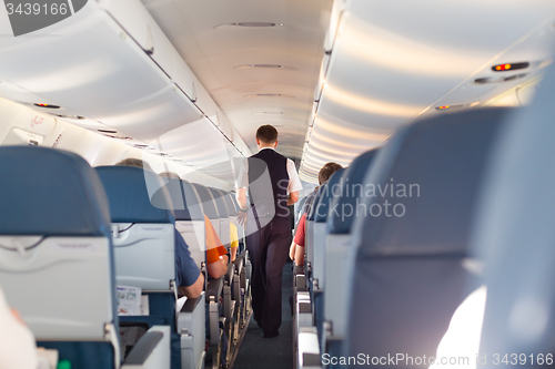 Image of Steward on the airplane.