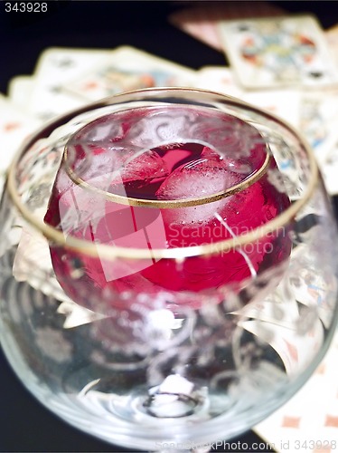 Image of Broken glass, wine and cards