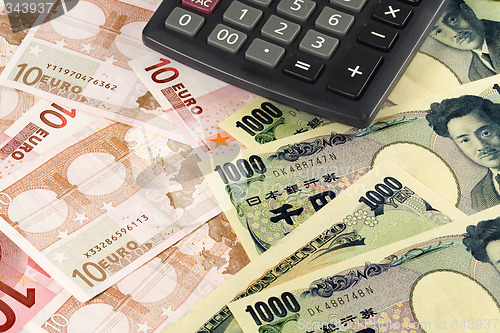 Image of Forex - Euro and Japanese currency pair with calculator

