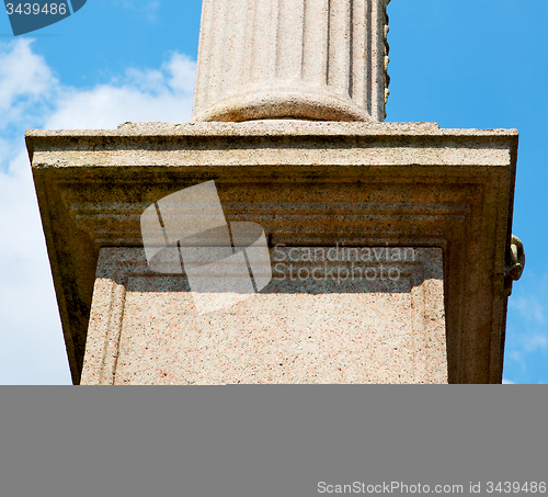 Image of old column in the cloudy sky of europe italy