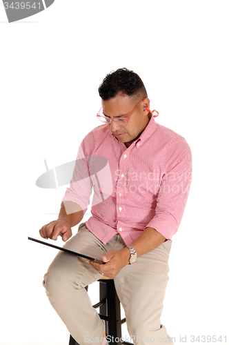 Image of Man working with his tablet computer.