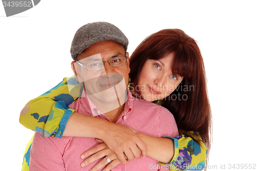 Image of Caucasian wife hugging her man.