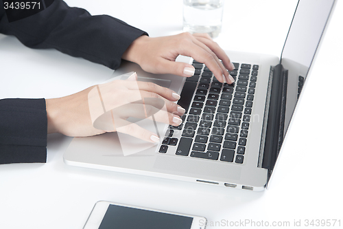 Image of Woman working on laptop