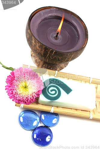Image of Candle, soap and flower.