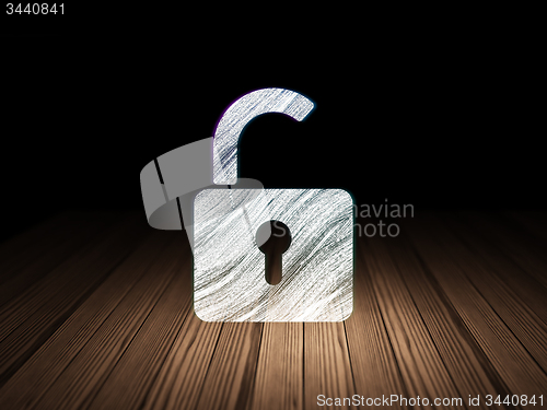 Image of Information concept: Opened Padlock in grunge dark room