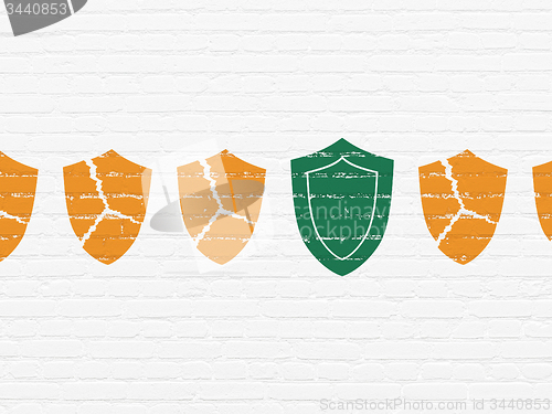 Image of Protection concept: shield icon on wall background