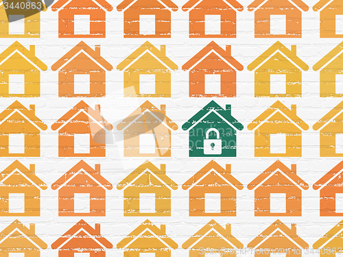 Image of Protection concept: home icon on wall background