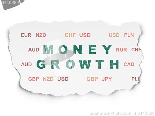 Image of Currency concept: Money Growth on Torn Paper background