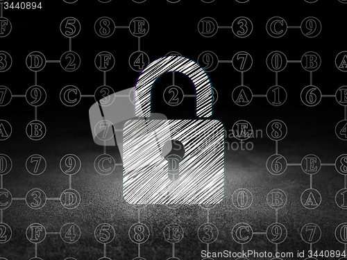 Image of Information concept: Closed Padlock in grunge dark room