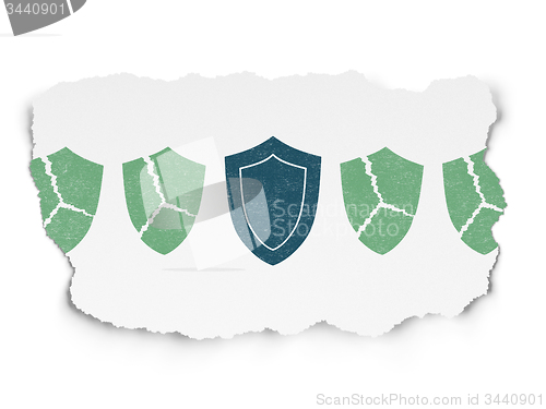 Image of Protection concept: shield icon on Torn Paper background