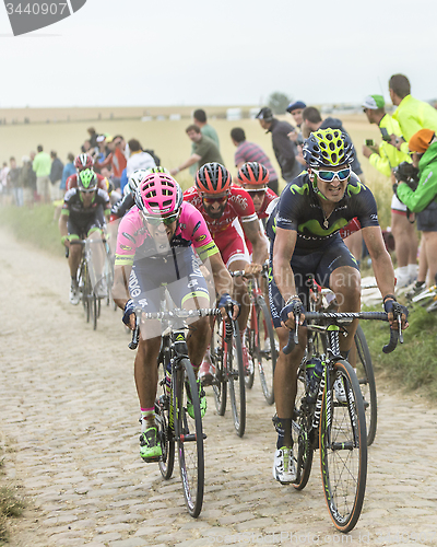 Image of The Peloton on a Cobblestone Road - Tour de France 2015