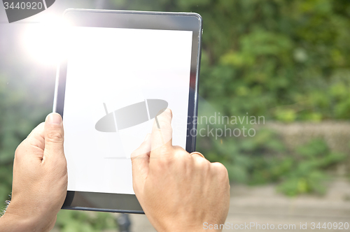 Image of Tapping on a tablet