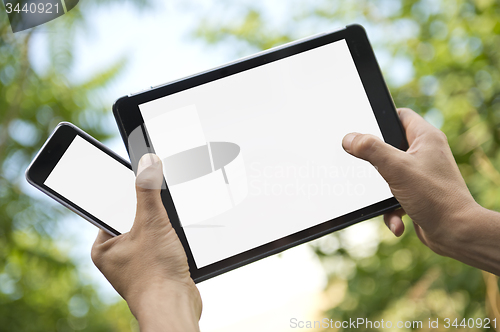 Image of Electronic tablet and smartphone