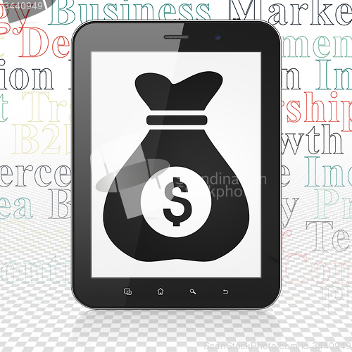 Image of Business concept: Money Bag on Tablet Computer display