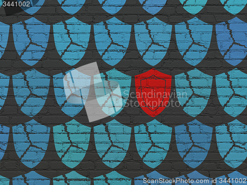 Image of Protection concept: shield icon on wall background