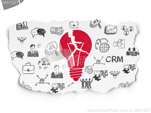 Image of Business concept: Light Bulb on Torn Paper background