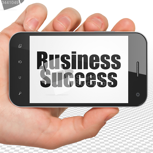 Image of Finance concept: Business Success on Hand Holding Smartphone display