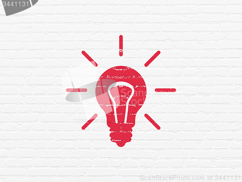 Image of Business concept: Light Bulb on wall background