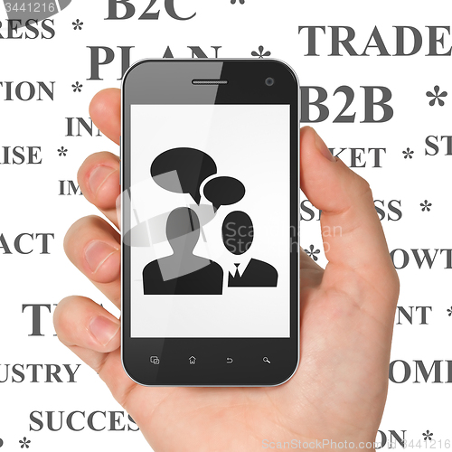 Image of Finance concept: Business Meeting on Hand Holding Smartphone display