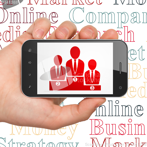 Image of Advertising concept: Business Team on Hand Holding Smartphone display