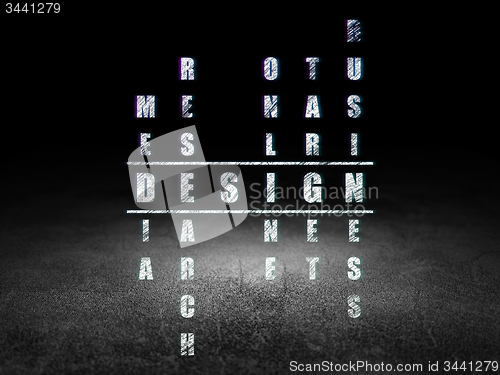 Image of Marketing concept: word Design in solving Crossword Puzzle