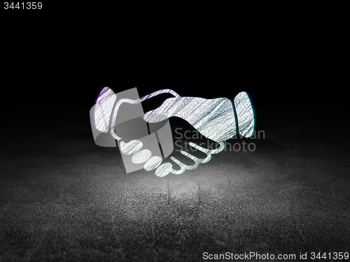 Image of Political concept: Handshake in grunge dark room