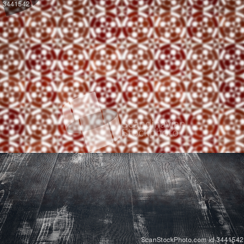 Image of Wood table top and blur vintage ceramic tile pattern wall