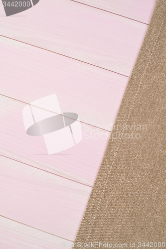 Image of Beige towel over wooden table