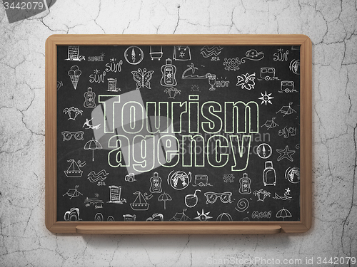 Image of Tourism concept: Tourism Agency on School Board background