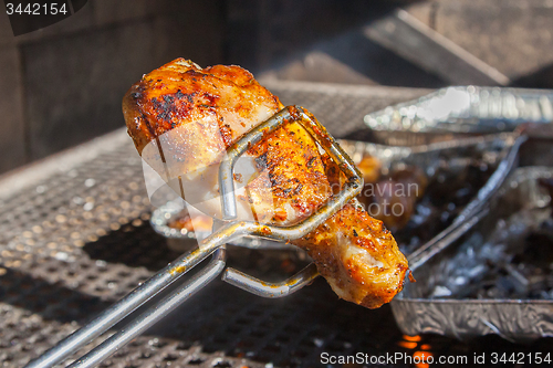 Image of Delicious chicken is getting ready on bbq