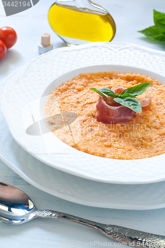 Image of Tomato soup with bread , garlic , oil , salt and pepper