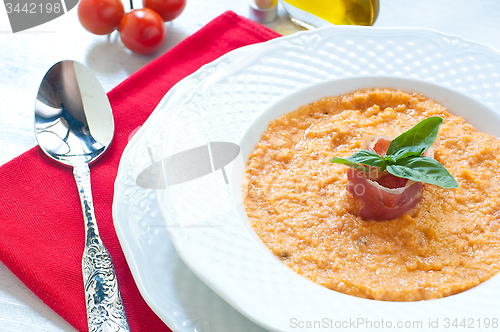 Image of Tomato soup with bread , garlic , oil , salt and pepper