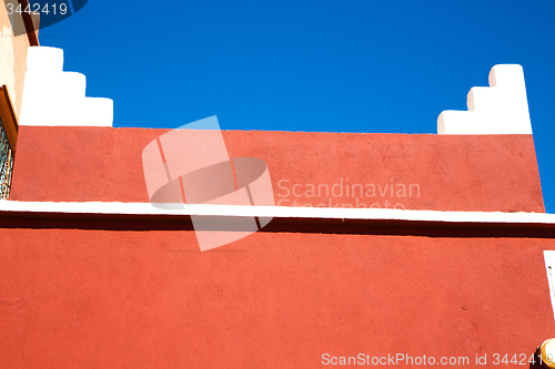 Image of moroccan old wall and brick red