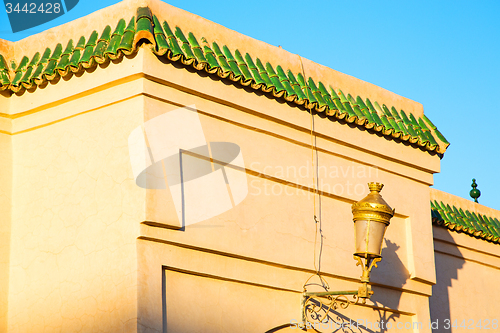 Image of tile roof  moroccan old wall and brick  