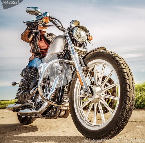 Image of Biker girl on a motorcycle