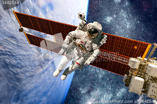 Image of International Space Station and astronaut.