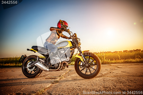 Image of Biker girl on a motorcycle