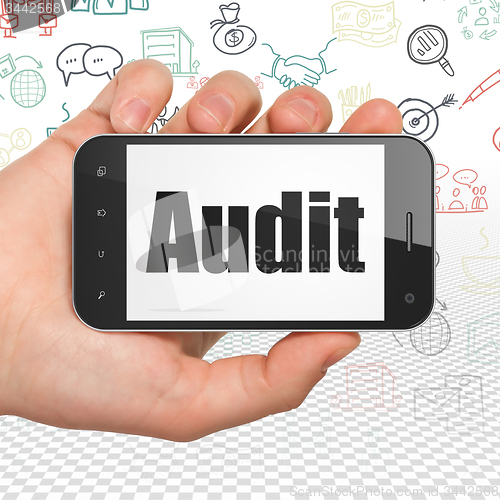 Image of Business concept: Audit on Hand Holding Smartphone display