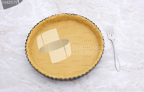 Image of Raw pastry case pricked with holes