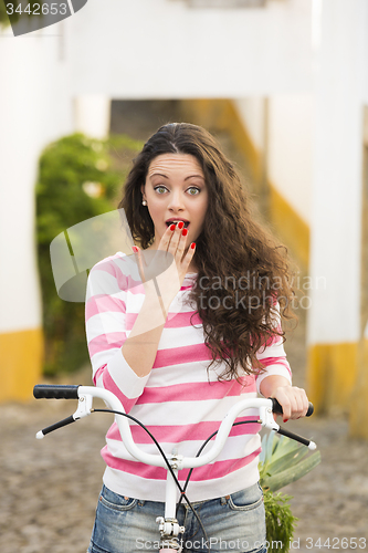 Image of Happy girl riding a bicycle 