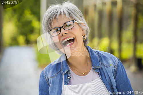 Image of Mature woman laughing