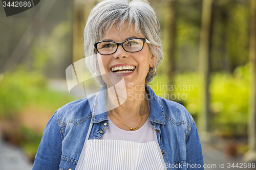 Image of Mature woman laughing